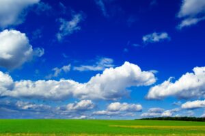air-clipart-a-field-with-blue-sky-and-white-clouds