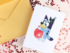 bluey-birthday-clipart-a-card-with-cartoon-cat-holding-heart