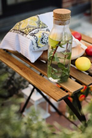 bottle-clipart-a-bottle-of-water-sitting-on-wooden-bench