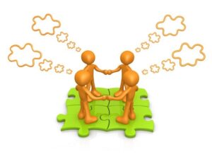 collaboration-clipart-two-orange-cartoon-characters-are-sitting-on-a-puzzle