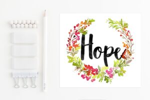 hope-clipart-a-white-wall-with-wreath-and-the-word-hope